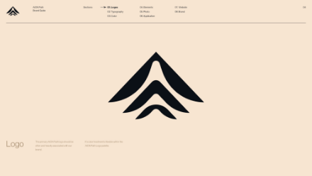 A beige background with a large, abstract black logo centered, resembling three stacked, curved lines or peaks. Minimalist text appears in light gray in the corners and above the logo.