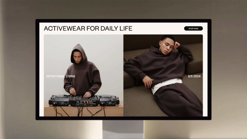 A computer screen displays an ad for activewear featuring a man in a brown hoodie DJing on the left and the same man lounging in matching pants and sweatshirt on the right. Text reads Activewear for daily life and S/S 2024.