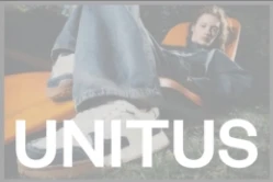 A person in jeans and sneakers reclines outdoors on an orange chair, with the word UNITUS in large white letters across the bottom of the image.
