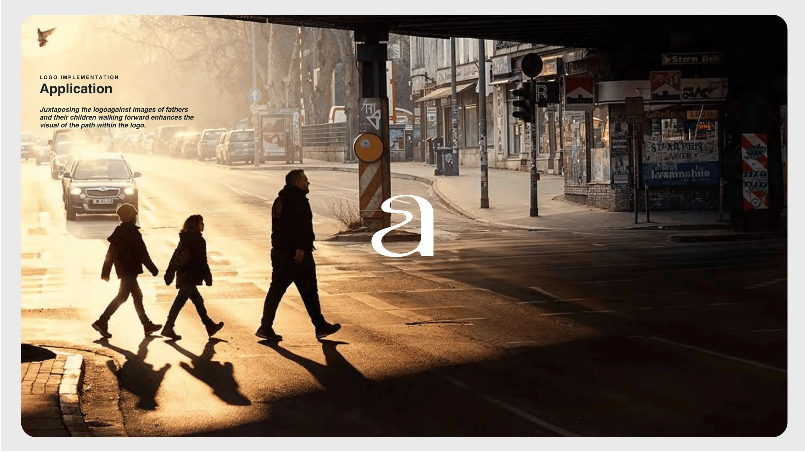 Three people, an adult and two children, walk across a sunlit city street, casting long shadows. There are cars parked on the left and buildings on the right. Text about logo implementation appears in the upper left corner.