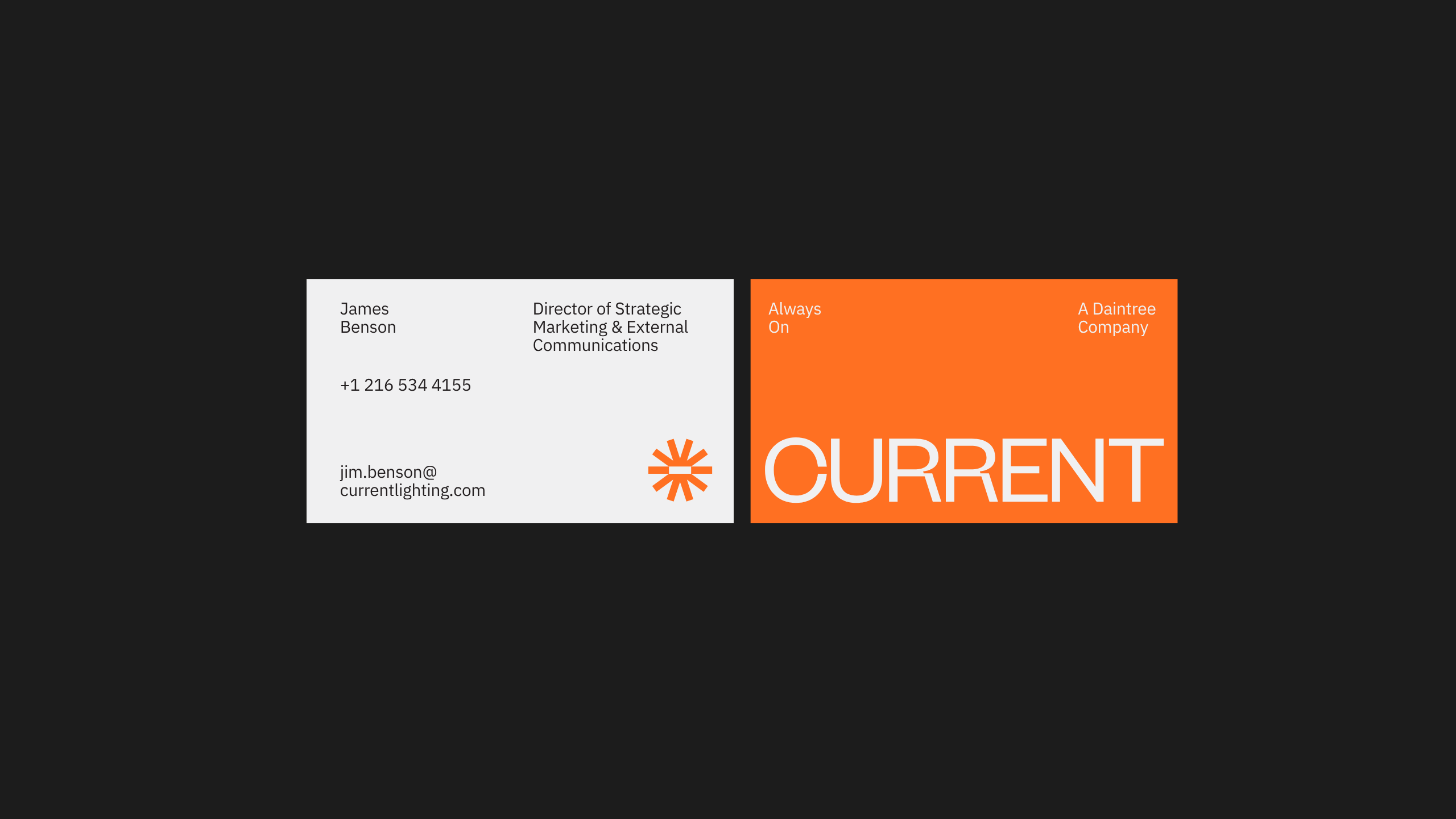 Two business cards on a black background. The left card is white with contact info for James Benson from Current Lighting. The right card is orange with the word CURRENT in bold white text and the tagline Always On.
