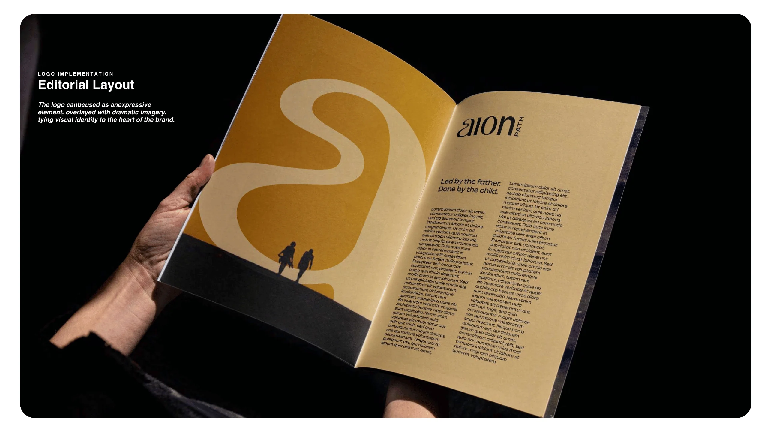 A person holds open a magazine featuring a bold yellow abstract design on the left page with two silhouetted figures, and a column of text titled aion with a poem and article on the right page.