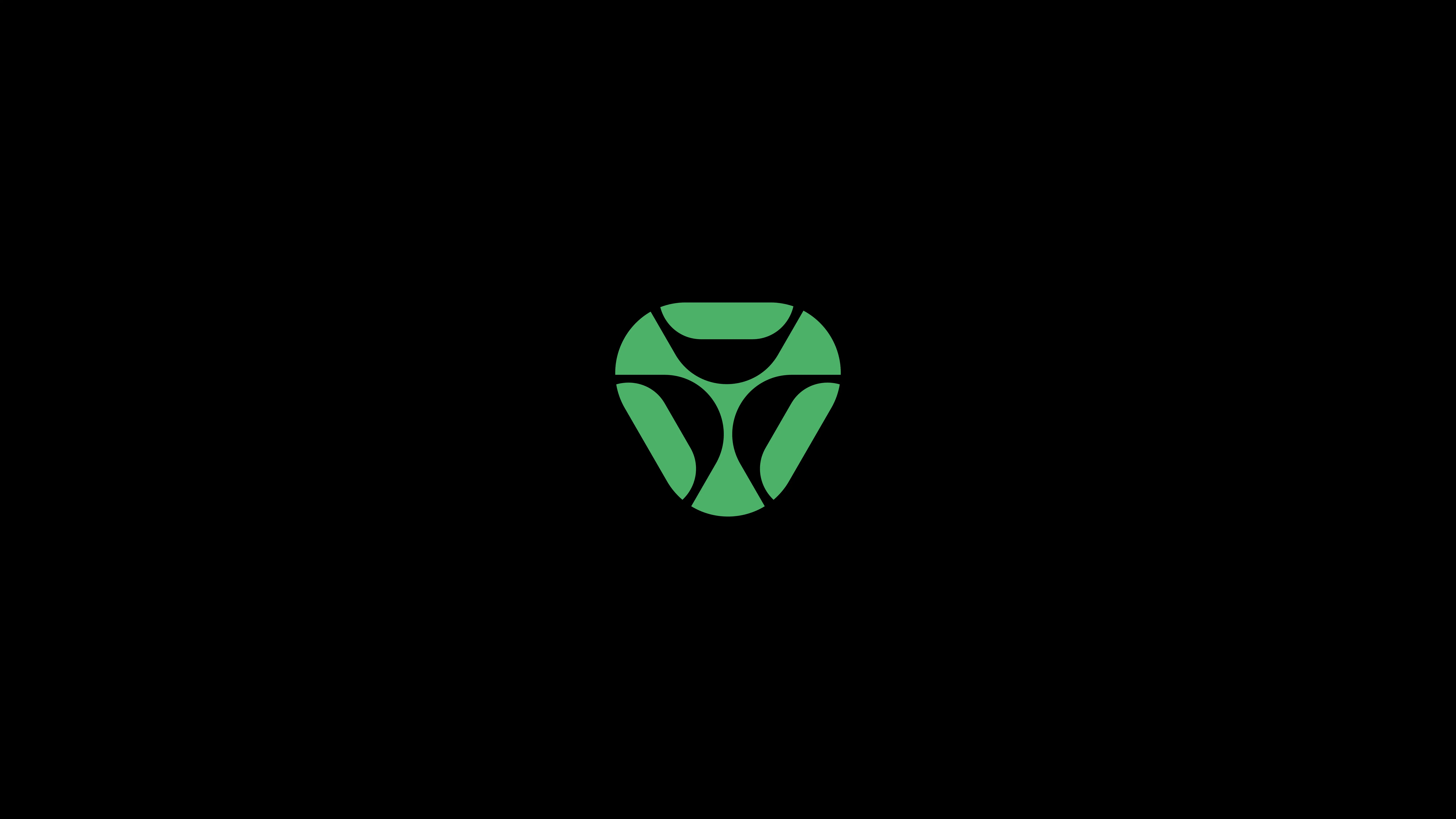 A minimalist green and black abstract logo resembling a stylized insect face or mask, centered on a black background.